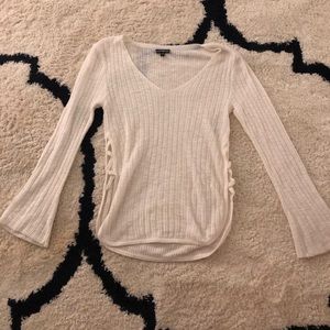 white sweater with side crosses